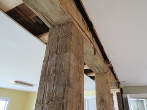 Hand-hewn beams salvaged from our shed.