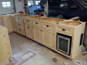 Custom made Maple cabinets...hand made by my father. (yes we have a spot for the wine cooler fridge)